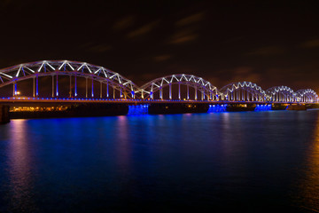 Railway bridge at night in Riga, Latvia