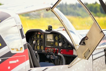 Fototapeta na wymiar Control panel in the small cockpit of a microlight plane