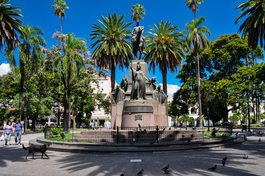 Salta's central plaza statue with palm trees, Argentina