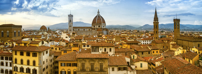 Fototapeta na wymiar roofs and view to Giotto belfry in Florence