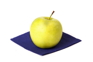 Small green apple on a napkin
