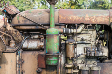 Fototapeta na wymiar Closeup of the engine of an old tractor