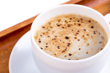Cup of coffee on a wooden