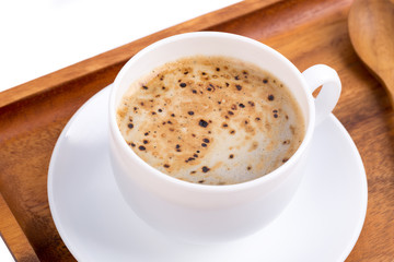 Cup of coffee on a wooden