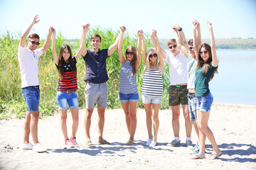 Obraz premium Beautiful young people on beach
