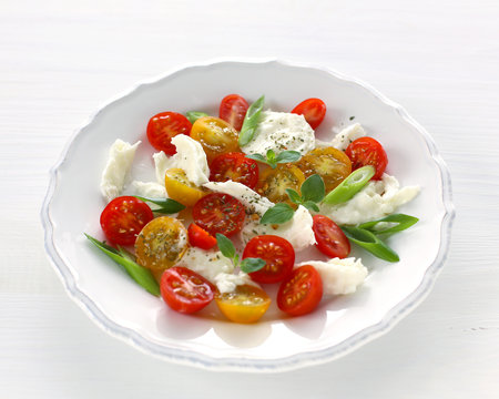 Mozzarella, red and yellow cherry tomatoes