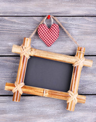 Rectangular chalkboard on wooden background