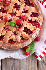 Tasty cake with berries on table close-up