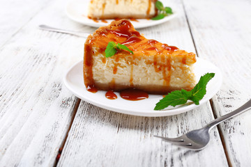 Cheese cake in plate on grey wooden background