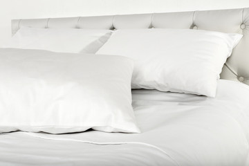 White pillows on bed in room