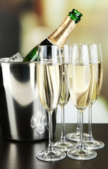 Champagne in glasses and bottle in restaurant