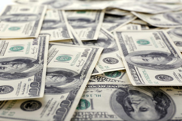 Lot of one hundred dollar bills close-up background