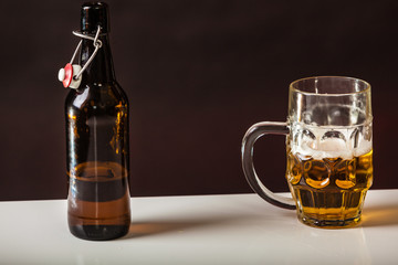 beer mug and bottle on table