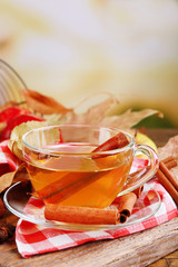 Apple cider with cinnamon sticks and fresh apples