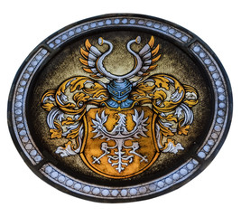 Stained glass window depicting the ancient coat of arms on the w
