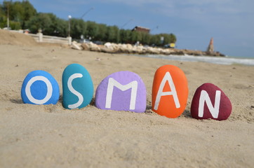 Fototapeta na wymiar Osman, turkish masculine name on colored stones