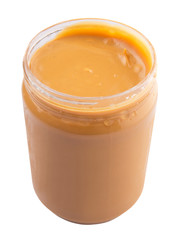 Peanut butter in a jar over white background