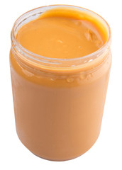 Peanut butter in a jar over white background
