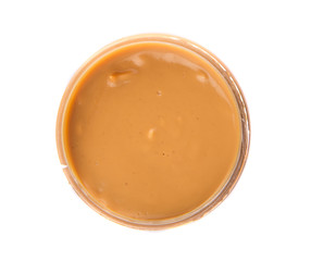 Peanut butter in a jar over white background