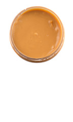 Peanut butter in a jar over white background