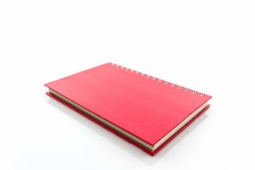 Red diary book on white background.