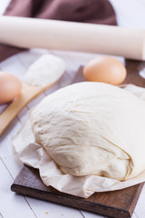 Dough on wooden board