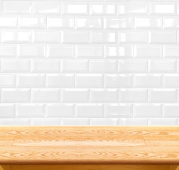 Empty wood table and ceramic tile brick wall in background. prod