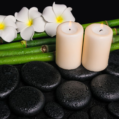 spa concept of zen basalt stones, three white flower frangipani,