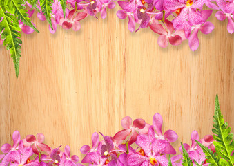 Old wooden background with pink Orchid flowers frame