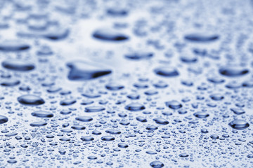 abstract water drops on polished stainless steel surface