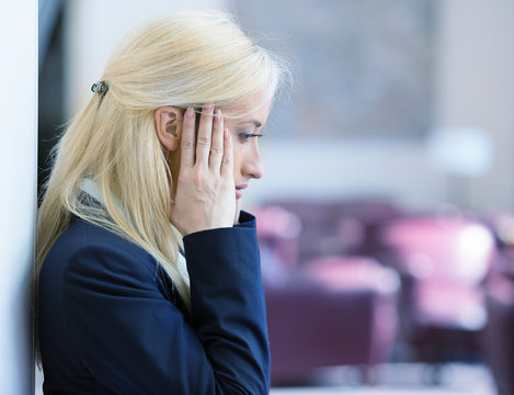 Side profile unhappy stressed young business woman