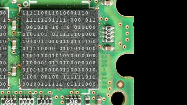Computer ram chips with binary code move past the camera.