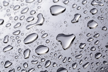 abstract water drops on polished stainless steel surface