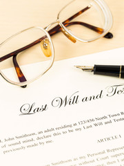 Fototapeta premium Last will on cream color paper with glasses and pen concept for
