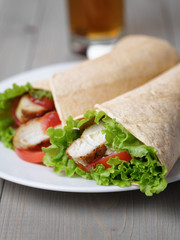 freshly made tortilla wraps with chicken and vegetables