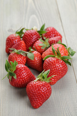 ripe strawberries on wood table