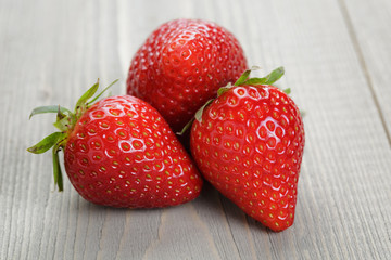 ripe strawberries on wood table