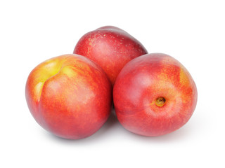 three ripe whole nectarines