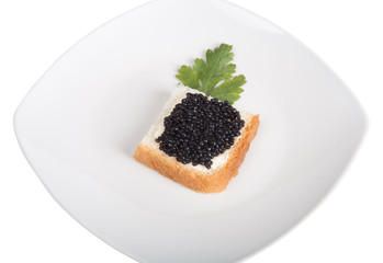 Bread with butter and caviar isolated on a white background