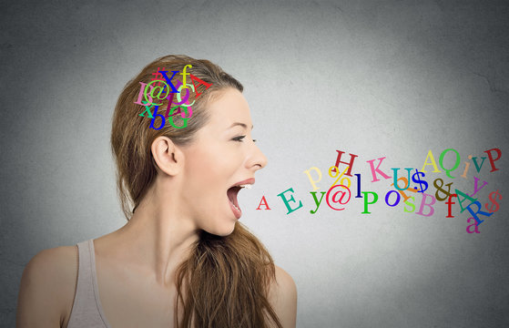 woman talking letters in her head coming out of mouth