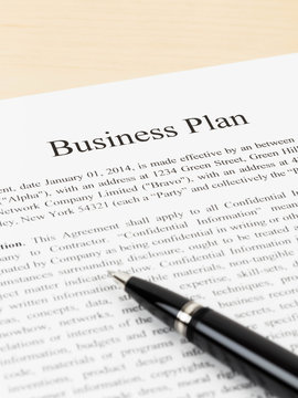 Business plan document with pen