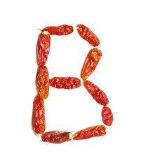 Alphabet letter B arranged from chili peppers isolated