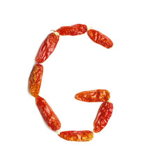 Alphabet letter G arranged from chili peppers isolated