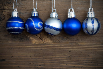 Five Decorated Christmas Balls in a Line