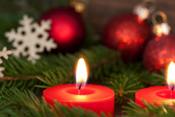 Fototapeta na wymiar Closeup of a Candle with Christmas Decoration