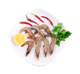 Raw tiger shrimps on plate.