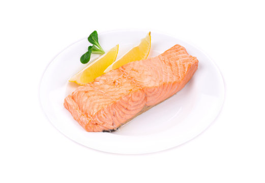 Fried Salmon Fillet On Plate With Lemon.