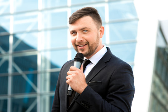 Portrait of well-dressed man on the contempopary background