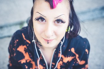 young beautiful punk dark girl listening music