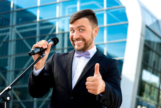 Portrait of well-dressed man on the contempopary background